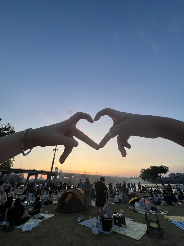 two hands making a heart