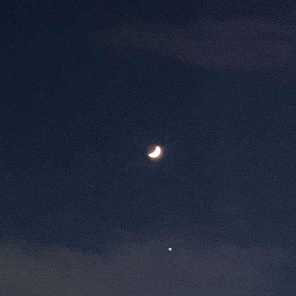 the moon with a few starts